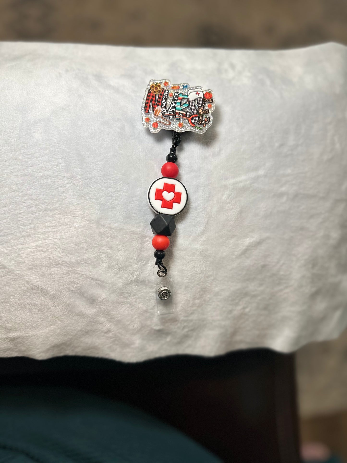BEADED BADGE REELS
